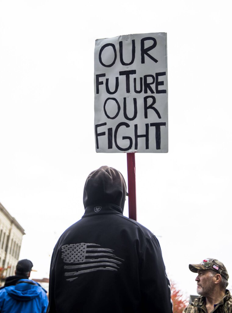 Ryan Pelland, a mechanic at Boeing for 17 years, stands outside of Angel of the Winds Arena with a sign that says “our future our fight” on Wednesday, Oct. 23, 2024 in Everett, Washington. (Olivia Vanni / The Herald)
