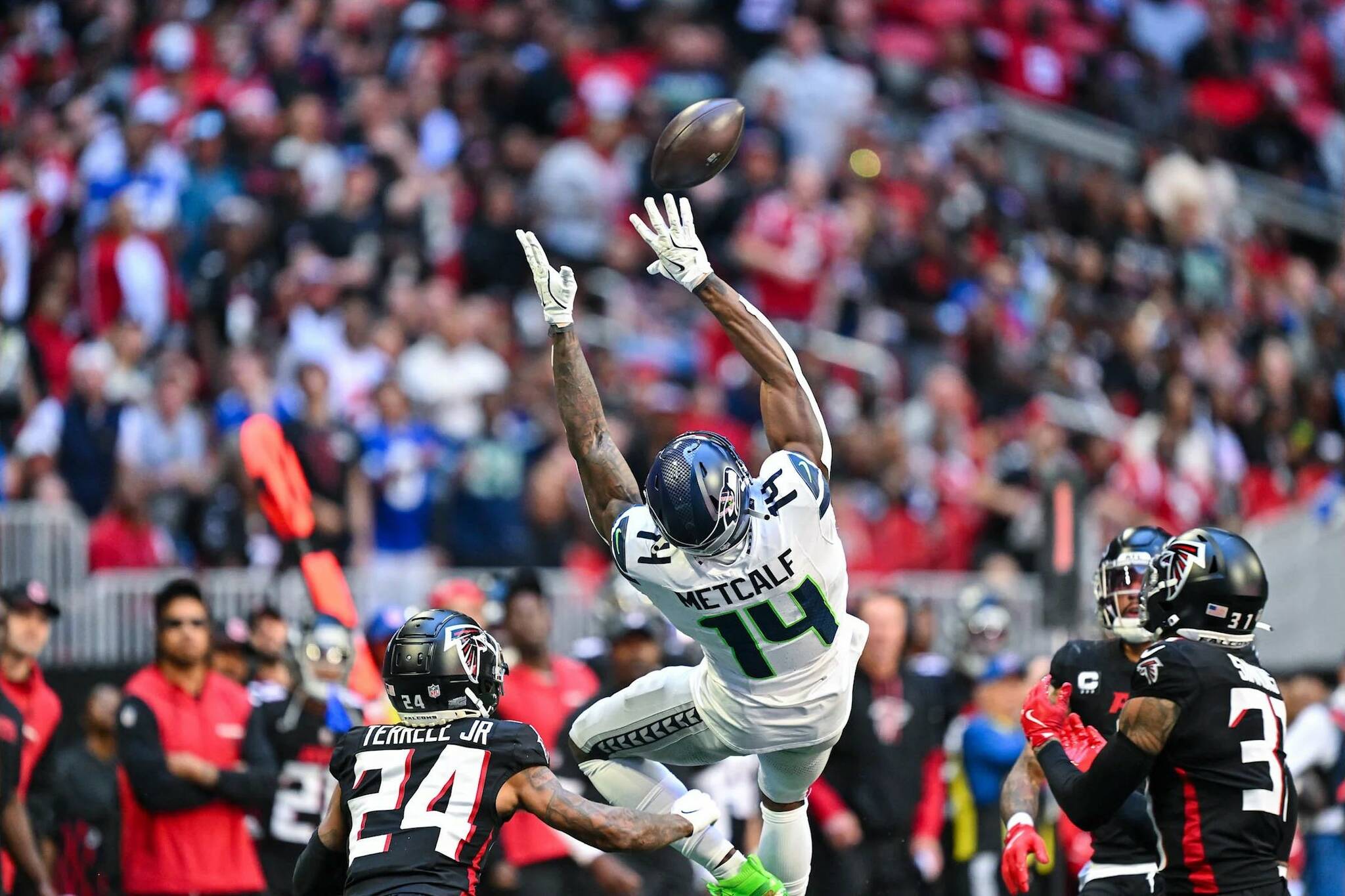 Seahawks wide receiver DK Metcalf (14) catches a pass against the Atlanta Falcons at Mercedez-Benz Stadium on Sunday, Oct. 20, 2024. (Photo courtesy of the Seattle Seahawks)