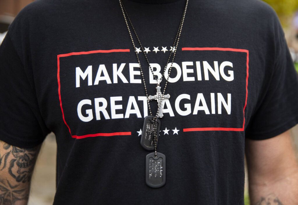 Ryan Hollifield wears a “make Boeing great again” shirt as he walks inside to vote on a proposed contract on Wednesday in Everett. (Olivia Vanni / The Herald)
