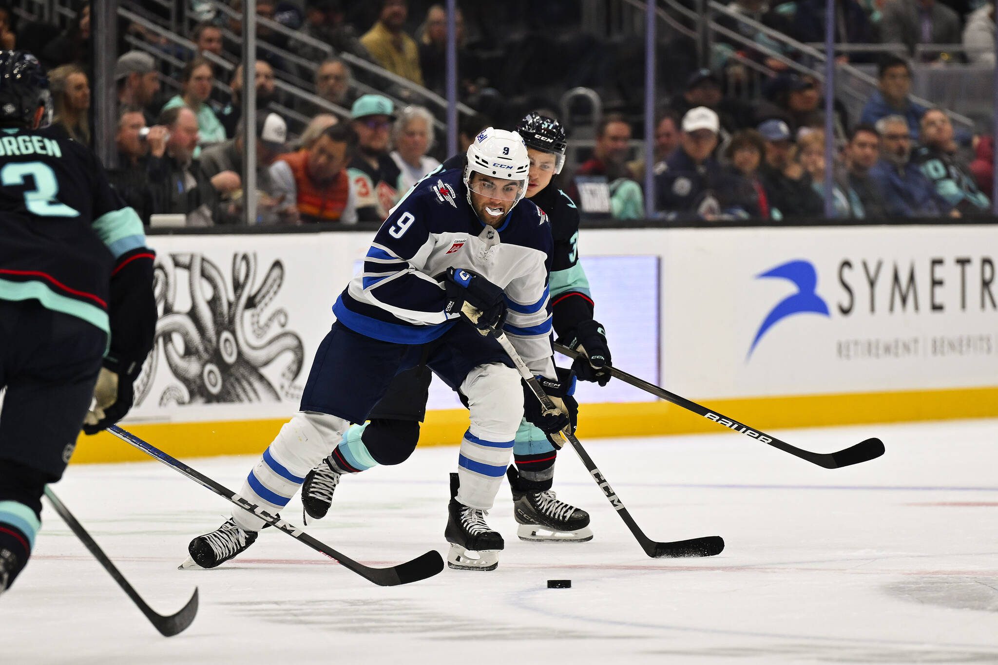 The Winnipeg Jets’ Alex Iafallo (9) skates after the puck as the Seattle Kraken’s Yanni Gourde (37) pursues the play during the first period at Climate Pledge Arena on Thursday, Oct. 24, 2024, in Seattle. (Alika Jenner / Getty Images / Tribune News Services)