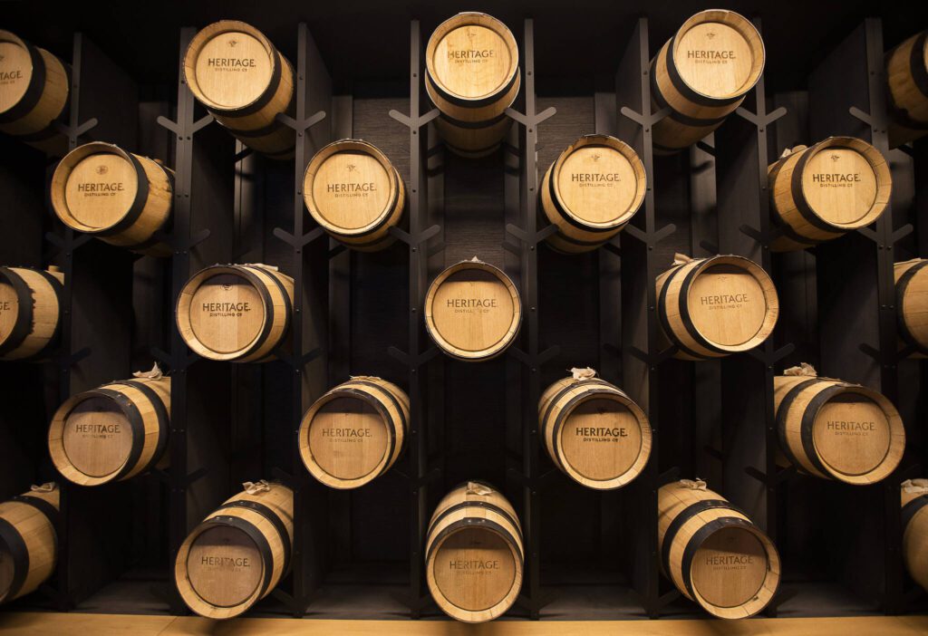 Small wooden casks line a wall at the new Heritage Distillery tasting room at Angel of the Winds Casino on Friday, Oct. 25, 2024 in Arlington, Washington. (Olivia Vanni / The Herald)
