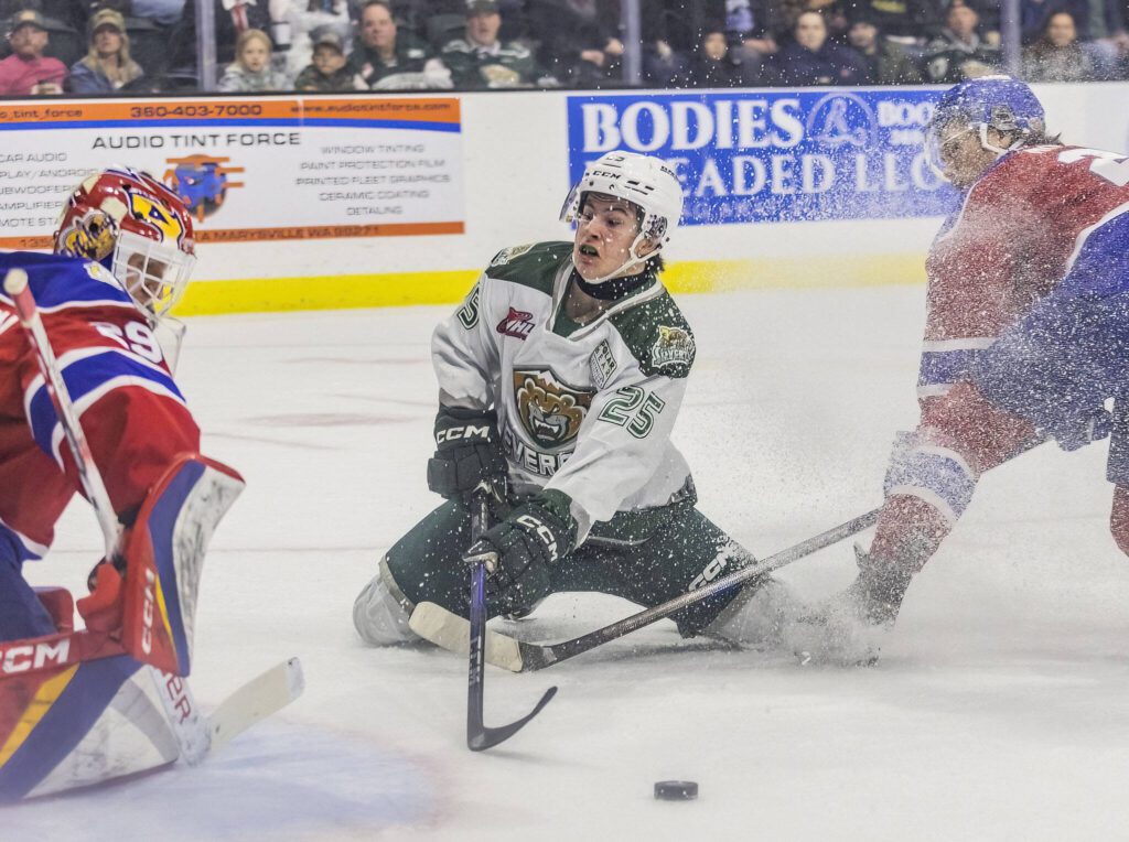 Silvertips’ Lukas Kaplan slides across the ice on his knees while trying to take a shot on goal during the game against the Edmonton Oil Kings on Friday, Oct. 25, 2024 in Everett, Washington. (Olivia Vanni / The Herald)
