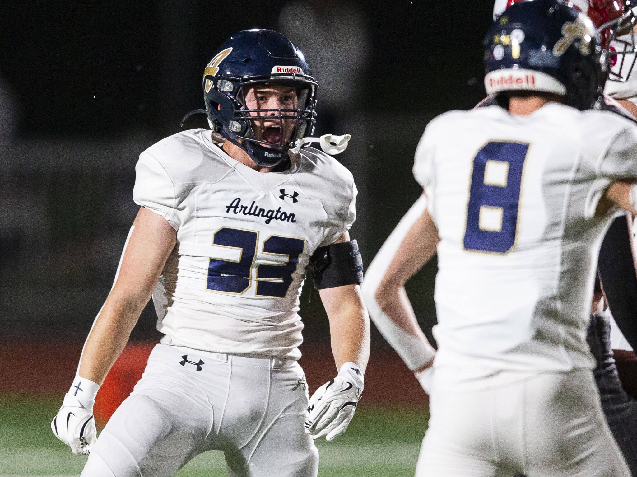 Arlington’s Jace Graham reacts to a tackle during the Stilly Cup game against Stanwood on Friday, Oct. 11, 2024 in Stanwood, Washington. (Olivia Vanni / The Herald)