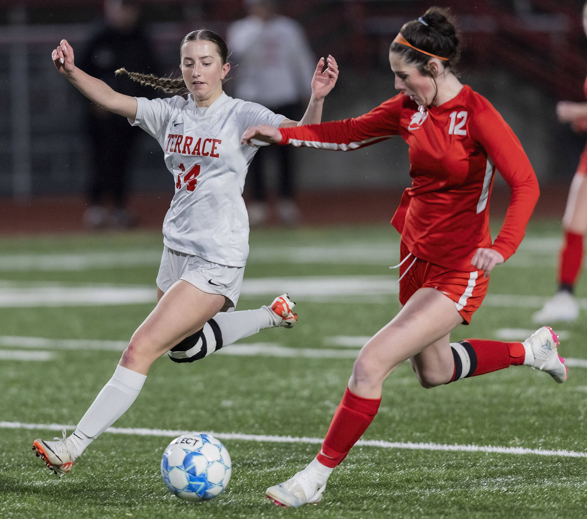 Mountlake Terrace’s Allison Mervin and Stanwood’s Addison Morton runs in sync after the ball during the 3A district game on Thursday, Oct. 31, 2024 in Stanwood, Washington. (Olivia Vanni / The Herald)