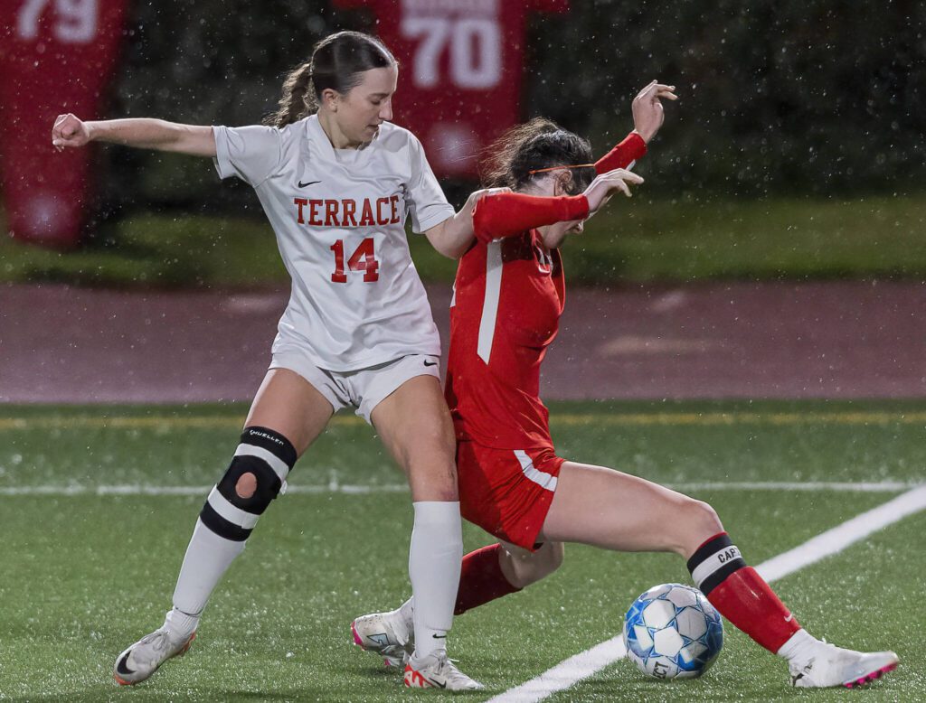 Stanwood’s Addison Morton takes the ball away from Mountlake Terrace’s Allison Mervin during the 3A district game on Thursday, Oct. 31, 2024 in Stanwood, Washington. (Olivia Vanni / The Herald)

