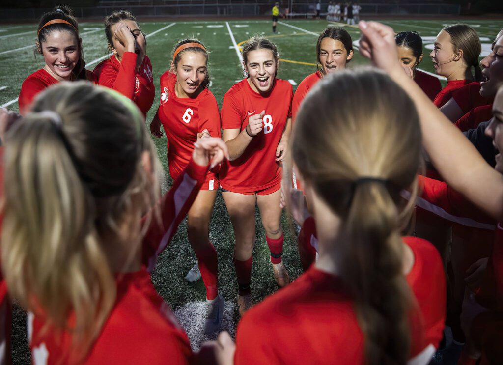 Stanwood players cheer before the start of the 3A district game against Mountlake Terrace on Thursday, Oct. 31, 2024 in Stanwood, Washington. (Olivia Vanni / The Herald)
