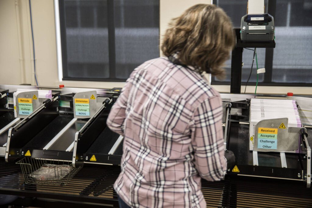 Ballots are sorted through a machine at Snohomish County Elections on Tuesday, Oct. 29, 2024 in Everett , Washington. (Olivia Vanni / The Herald)
