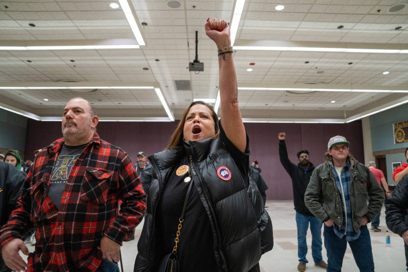 Gina Forbush, of Gig Harbor, Wash., reacting to news that striking Boeing machinists had rejected a tentative labor contract, at the IAM 751 Union Hall in Seattle on Oct. 23, 2024. Boeing’s largest union rejected a tentative labor contract on Wednesday by a wide margin, extending a damaging strike and adding to the mounting financial problems facing the company, which hours earlier had reported a $6.1 billion loss. (M. Scott Brauer/The New York Times)