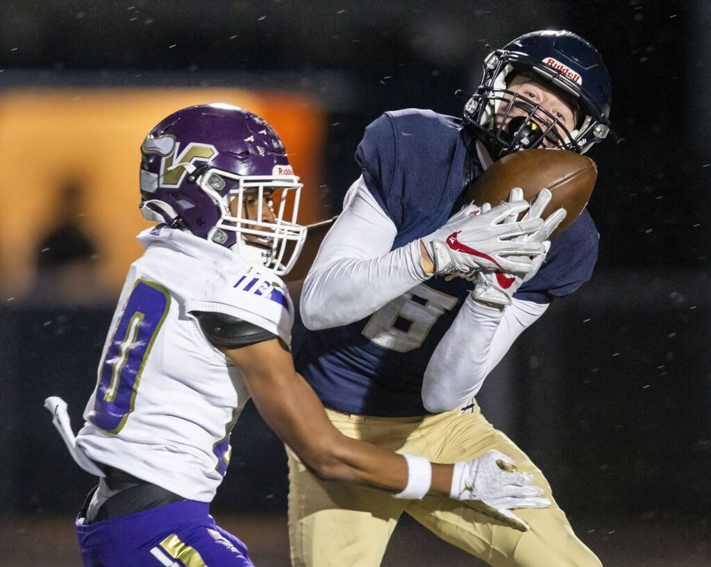 Arlington’s Kaid Hunter makes a catch and runs into the end zone for a touchdown during the game against Lake Stevens on Friday, Nov. 1, 2024 in Arlington, Washington. (Olivia Vanni / The Herald)
