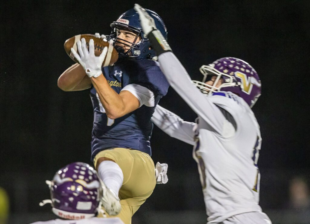 Arlington’s Jake Willis picks off a pass during the game against Lake Stevens on Friday, Nov. 1, 2024 in Arlington, Washington. (Olivia Vanni / The Herald)
