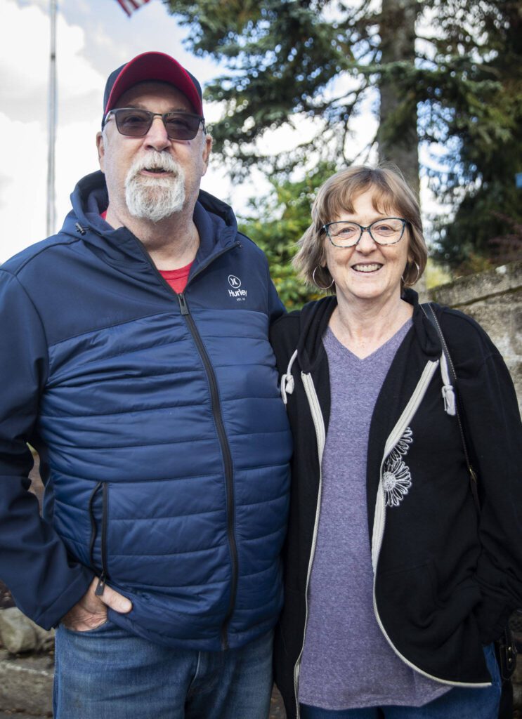 Richard and Tina Davis outside of the Arlington Library on Election Day on Tuesday, Nov. 5, 2024 in Arlington, Washington. (Olivia Vanni / The Herald)
