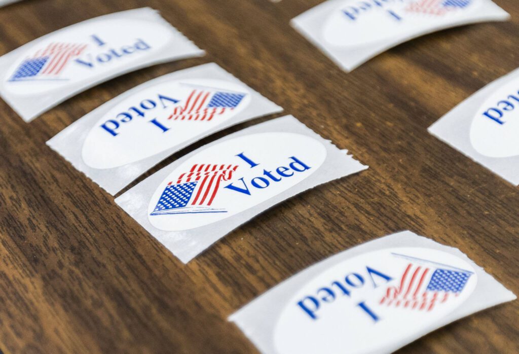 “I Voted” stickers cover a table at the entrance to the Snohomish County Auditor’s Office on Tuesday, Nov. 5, 2024 in Everett, Washington. (Olivia Vanni / The Herald)
