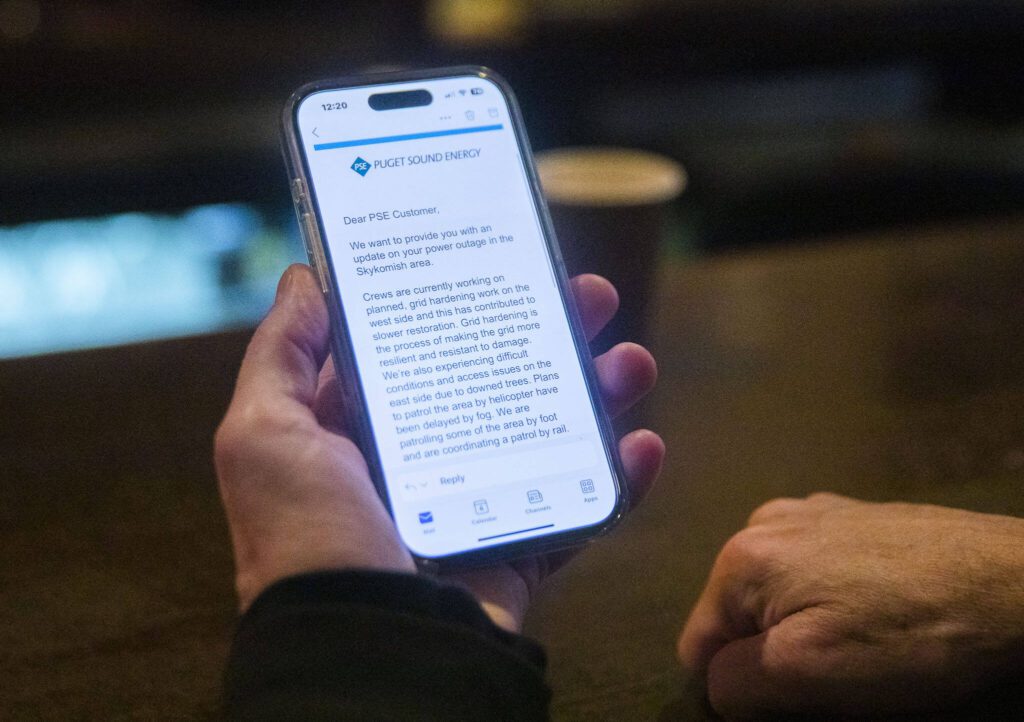 Vernon Streeter shows an email he was sent by Puget Sound Energy with an explanation for a power outage during October on Monday, Nov. 4, 2024 in Skykomish, Washington. (Olivia Vanni / The Herald)
