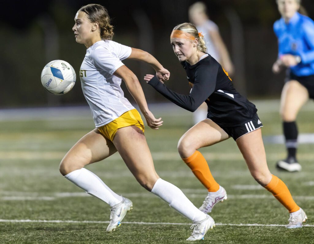 Shorecrest’s Olivia Taylor runs through the ball with her chest while running down the field during the 3A district game against Monroe on Thursday, Nov. 7, 2024 in Shoreline, Washington. (Olivia Vanni / The Herald)

