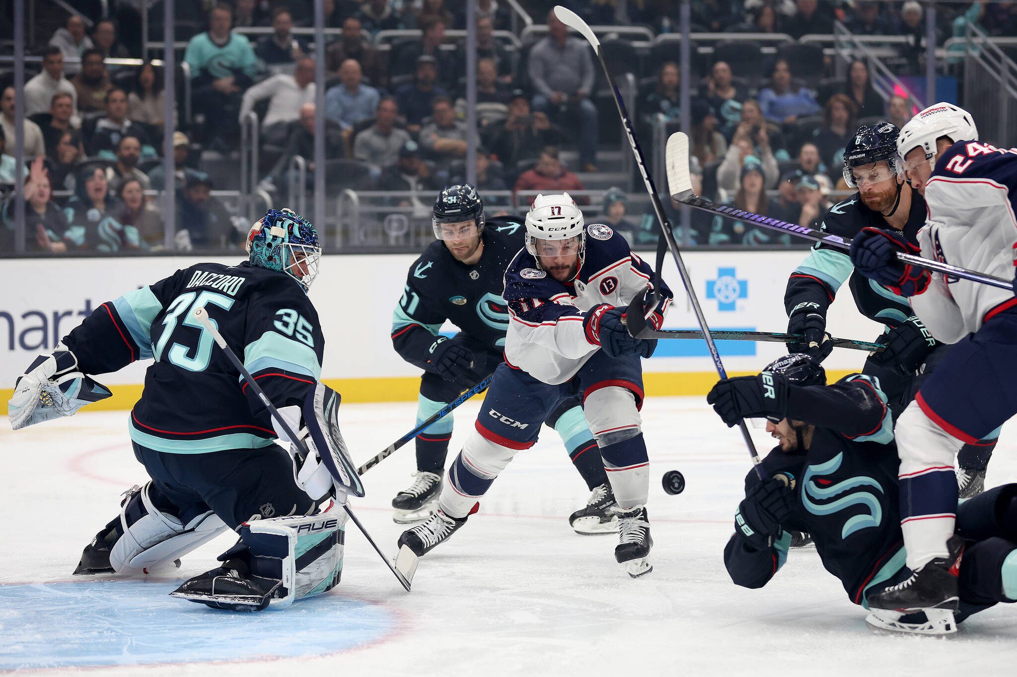 Steph Chambers / Getty Images / Tribune News Services
The Columbus Blue Jackets’ Justin Danforth (17) shoots against Seattle Kraken goaltender Joey Daccord (35) during the first period at Climate Pledge Arena on Tuesday, Nov. 12, 2024.