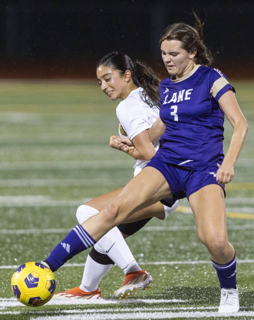 Lake Stevens’ Cora Jones has her arm pulled while dribbling the ball during the 4A state playoff game against Richland on Wednesday, Nov. 13, 2024 in Lake Stevens, Washington. (Olivia Vanni / The Herald)
