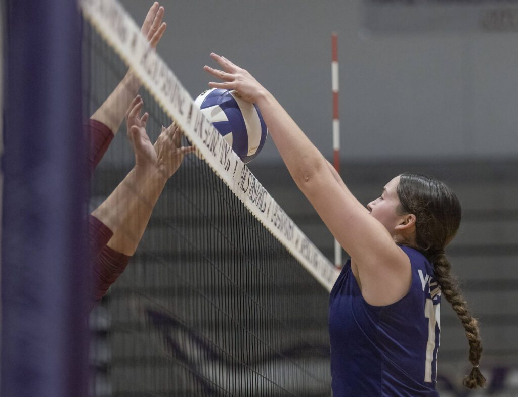 Lake Stevens’ Olivia Gonzales blocks a tipped ball from coming over the net during the 4A district semifinal game on Thursday, Nov. 14, 2024 in Lynnwood, Washington. (Olivia Vanni / The Herald)
