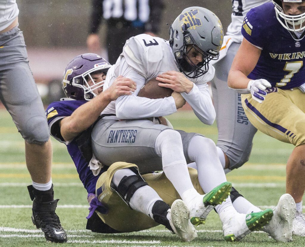 Lake Stevens’ Luke Baird sacks Mead’s Jaeland Leman during the 4A state playoff game against Lake Stevens on Saturday, Nov. 16, 2024 in Lake Stevens, Washington. (Olivia Vanni / The Herald)
