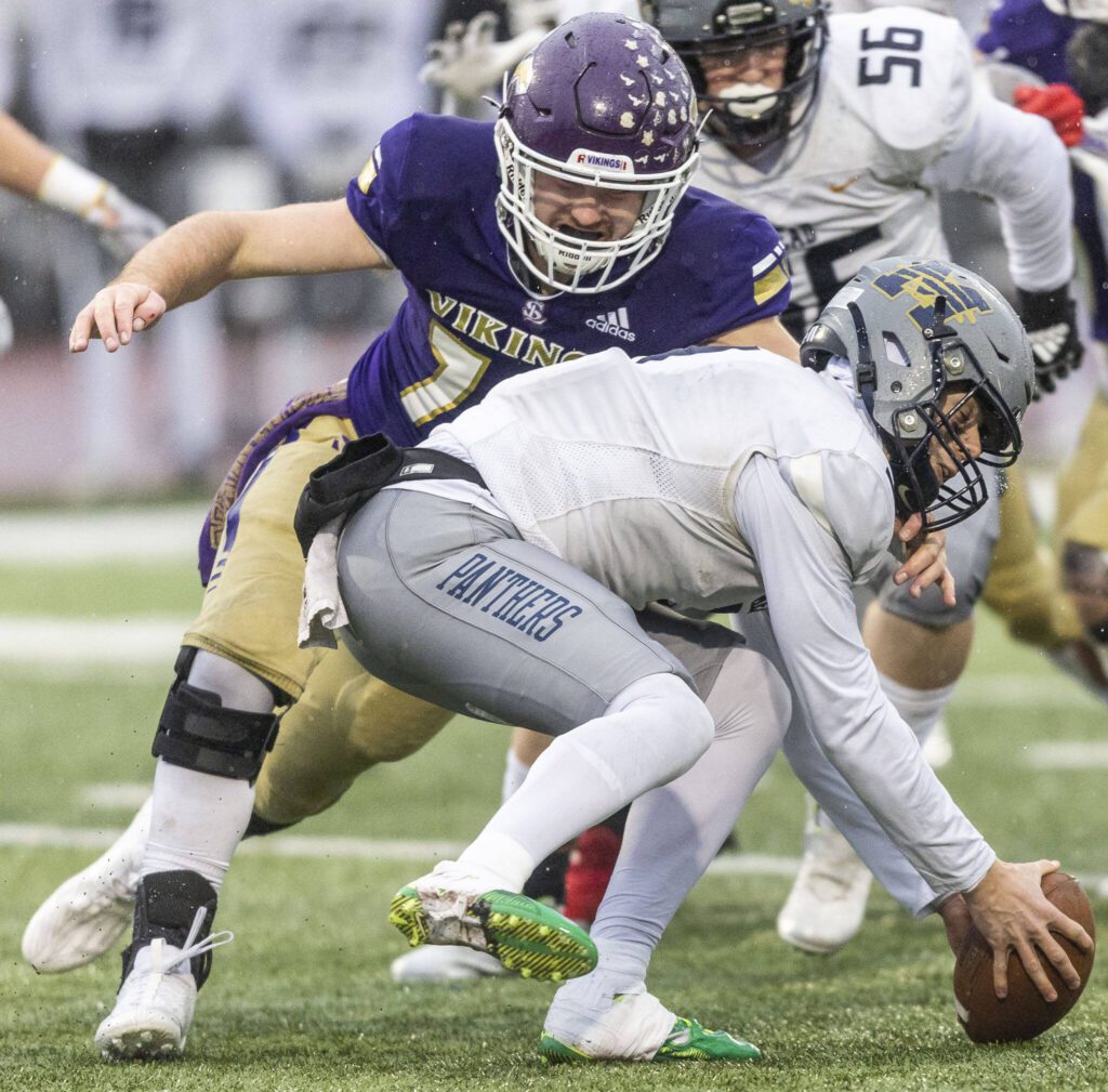 Lake Stevens’ Luke Baird sacks Mead’s Jaeland Leman during the 4A state playoff game on Saturday, Nov. 16, 2024 in Lake Stevens, Washington. (Olivia Vanni / The Herald)
