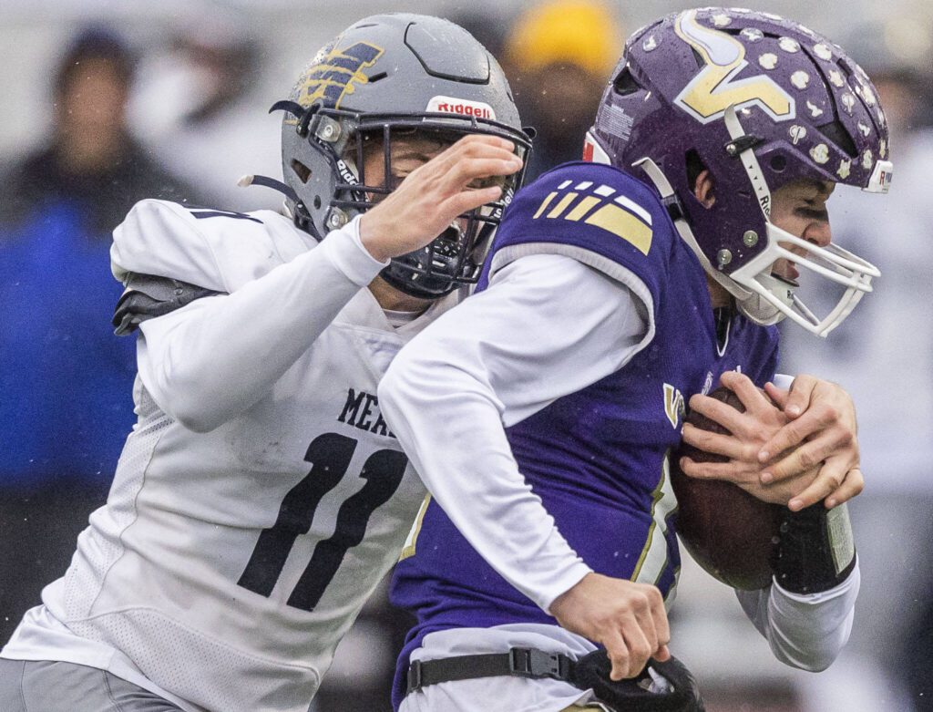 Lake Stevens’ Kolton Matson grimaces as he is tackled during the 4A state playoff game against Mead on Saturday, Nov. 16, 2024 in Lake Stevens, Washington. (Olivia Vanni / The Herald)
