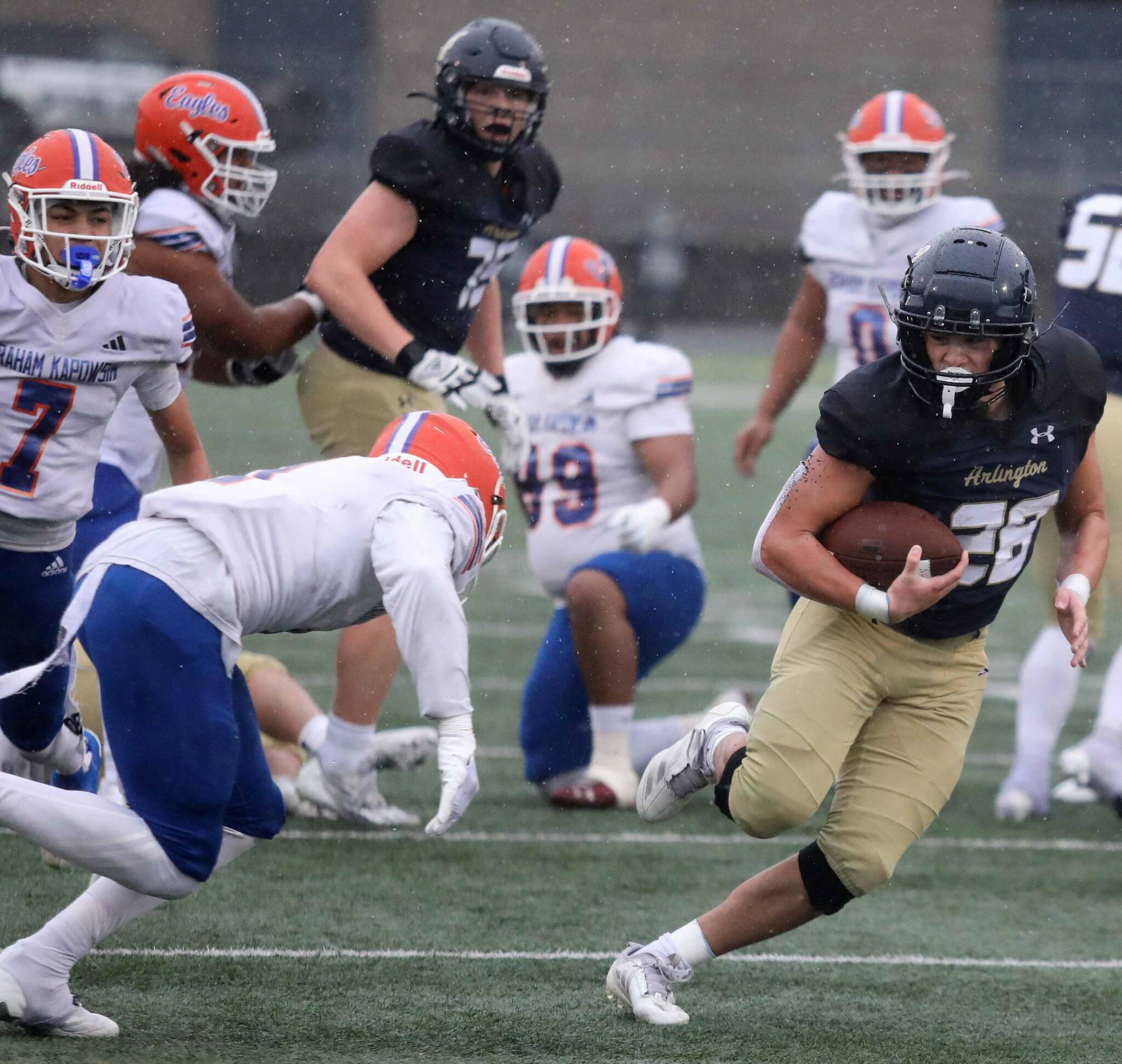 Arlington senior running back Caleb Reed runs with the football during a first-round game of the Class 4A state tournament against Graham-Kapowsin in Arlington, Wash., on Saturday, Nov. 16, 2024. The Eagles won, 42-6. (Taras McCurdie / The Herald)