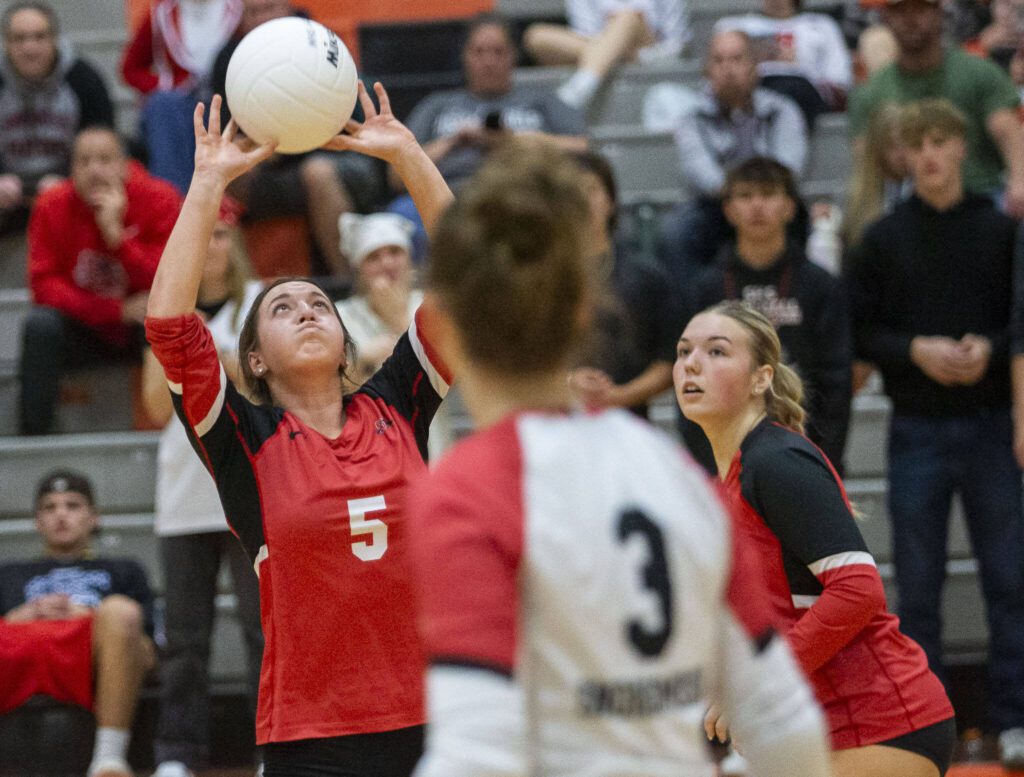 Snohomish’s Julia DeLeone sets the ball during the game against Monroe on Wednesday, Oct. 16, 2024 in Monroe, Washington. (Olivia Vanni / The Herald)
