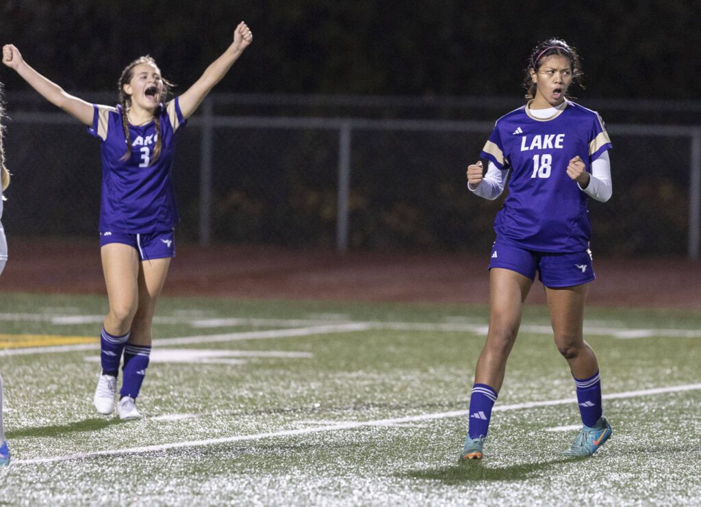 Lake Stevens’ Noelani Tupua yells in celebration after scoring during the 4A state playoff game against Richland on Wednesday, Nov. 13, 2024 in Lake Stevens, Washington. (Olivia Vanni / The Herald)
