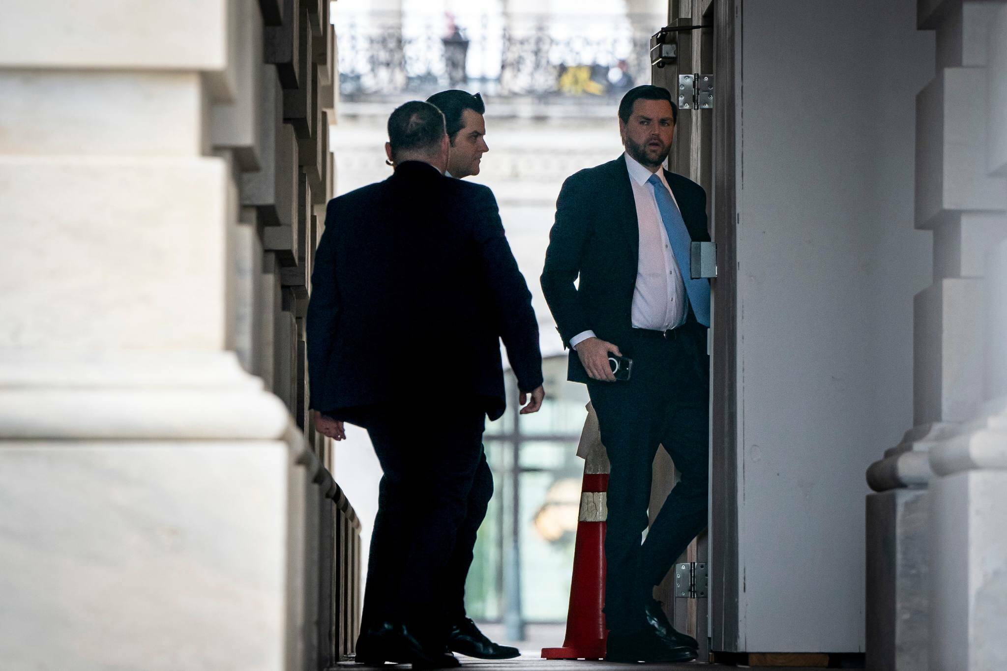 Former Rep. Matt Gaetz, R-Fla., center, arrives at the U.S. Capitol in Washington D.C. with Sen. JD Vance, R-Ohio, right, the vice president-elect, on Wednesday morning. Gaetz withdrew from consideration Thursday, saying he was an unfair distraction to the transition. (Haiyun Jiang / The New York Times)