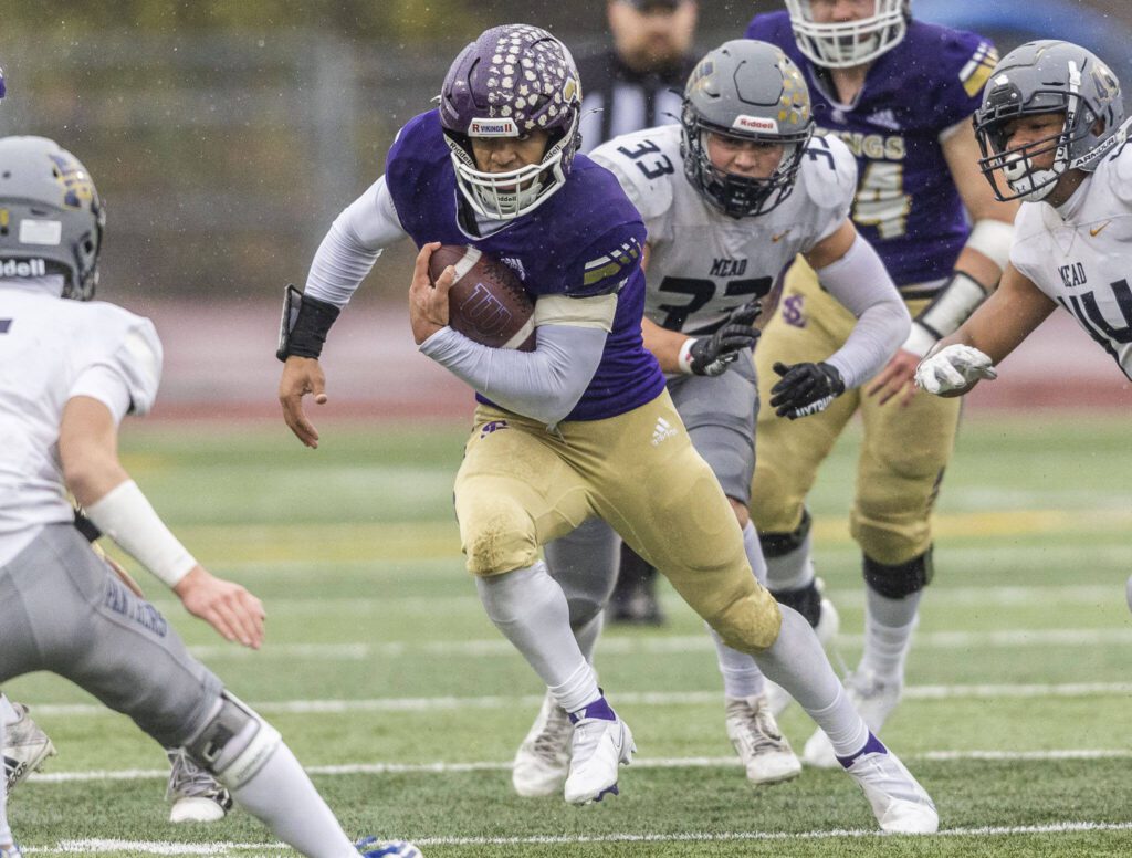 Lake Stevens’ Jayshon Limar runs the ball during the 4A state playoff game against Mead on Saturday, Nov. 16, 2024 in Lake Stevens, Washington. (Olivia Vanni / The Herald)
