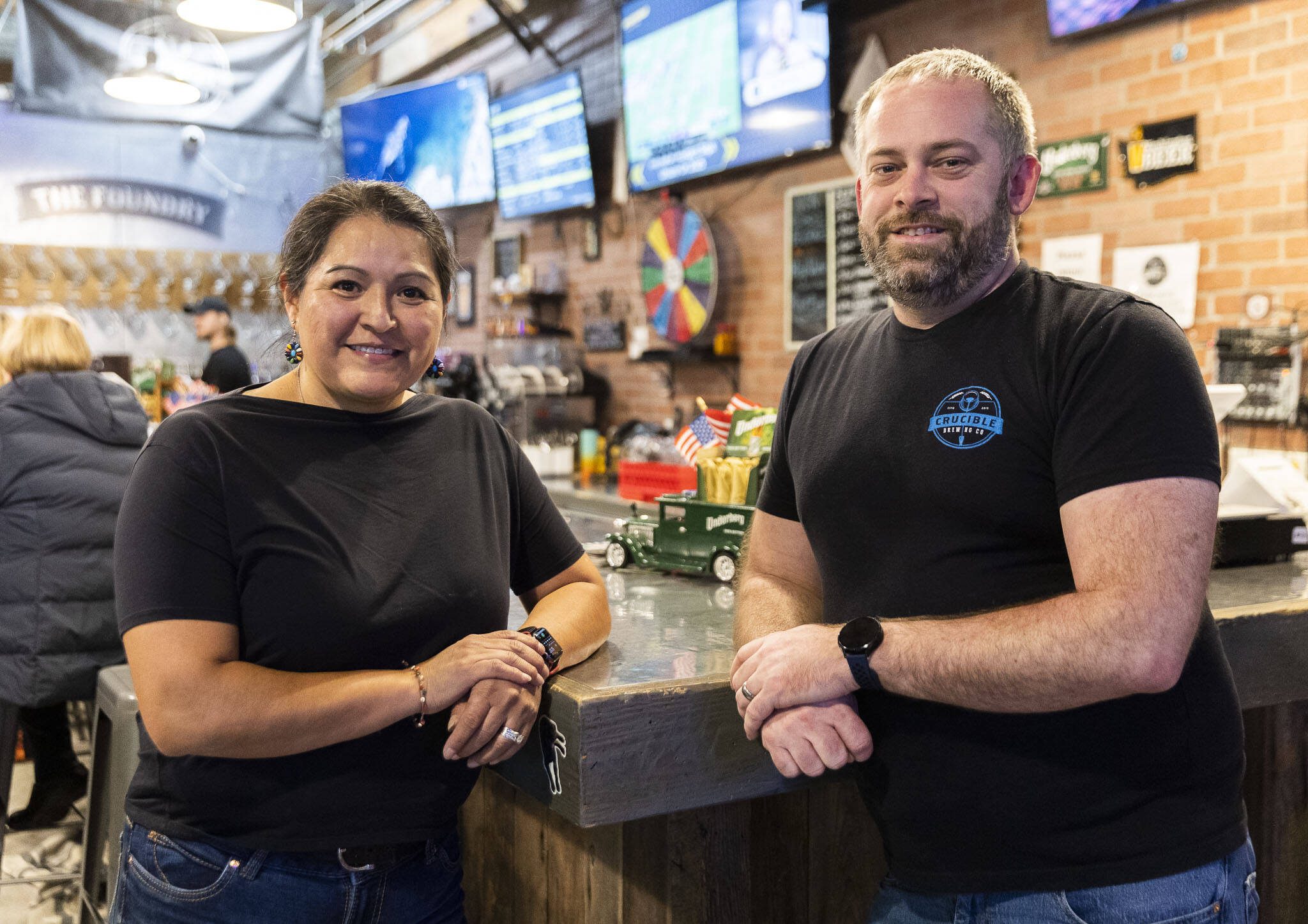 The new Crucible Brewing owners Johanna Watson-Andresen and Erik Andresen inside the south Everett brewery on Wednesday, Nov. 27, 2024. (Olivia Vanni / The Herald)