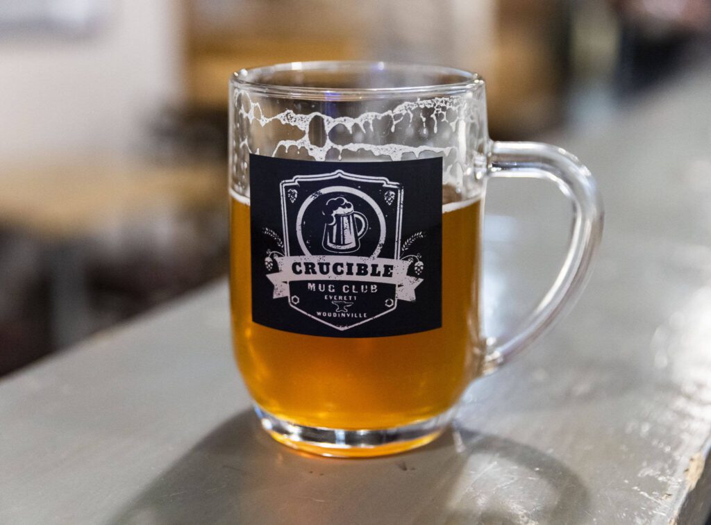 A Crucible Mug Club mug available to patrons on Wednesday, Nov. 27, 2024 in Everett, Washington. (Olivia Vanni / The Herald)
