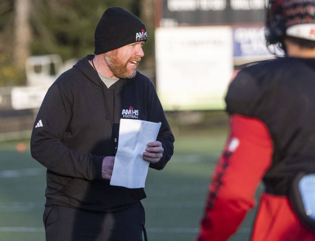 Archbishop Murphy head coach Joe Cronin talks his players through a drill during football practice on Wednesday, Nov. 27, 2024 in Everett, Washington. (Olivia Vanni / The Herald)
