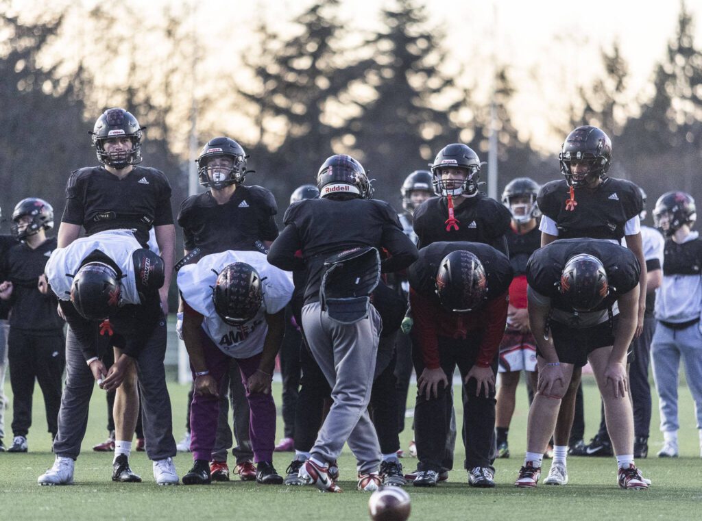 The Archbishop Murphy offense lines up to run a play during football practice on Wednesday, Nov. 27, 2024 in Everett, Washington. (Olivia Vanni / The Herald)
