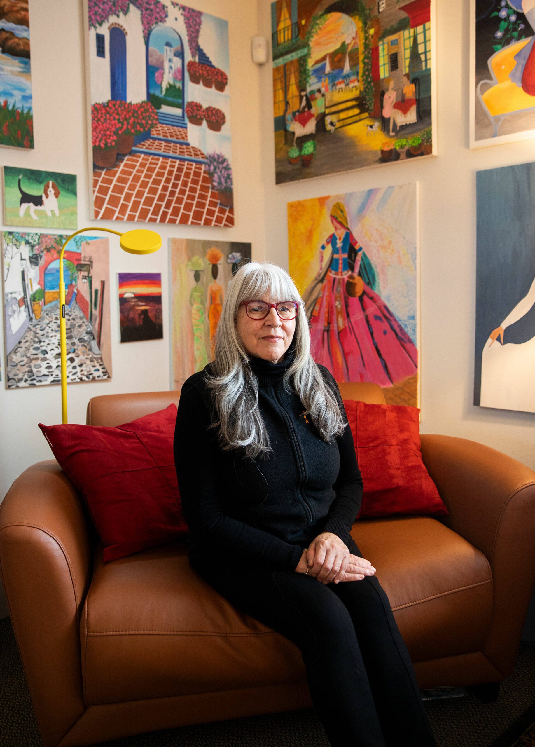 Mary Toews, the executive director and founder of Mari’s Place, in her office surrounded by pieces of art created by former and current students on Monday, Dec. 2, 2024 in Everett, Washington. (Olivia Vanni / The Herald)