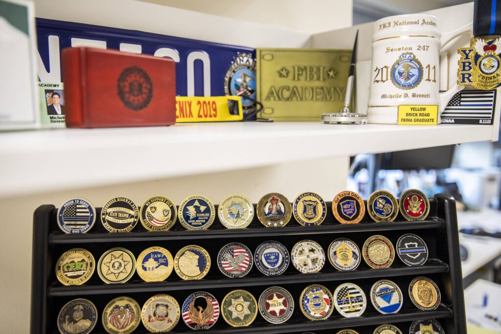 Mementos from Edmonds Police Chief Michelle Bennett’s time at the police department and some of her specialty training she completed through out her law enforcement career on Wednesday, Dec. 11, 2024 in Edmonds, Washington. (Olivia Vanni / The Herald)
