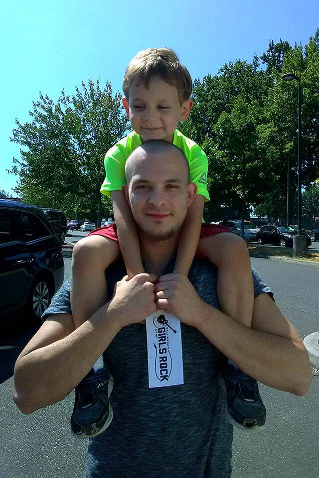 Anthony Christie with his son. (Provided photo)