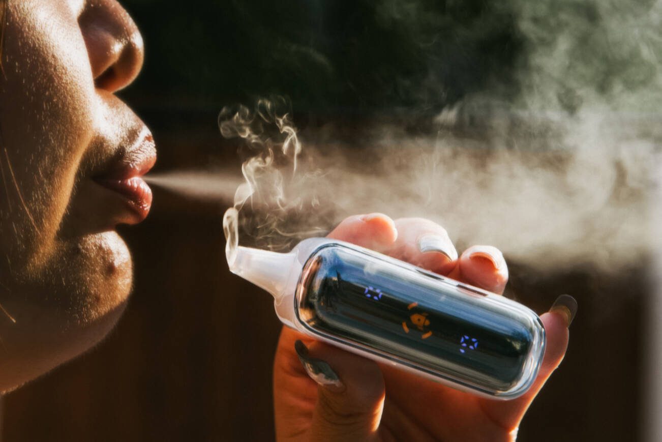A person vaping in New York, July 7, 2024. Millions of Americans use e-cigarettes — there’s little research into how to help them stop. (Justin J Wee/The New York Times)