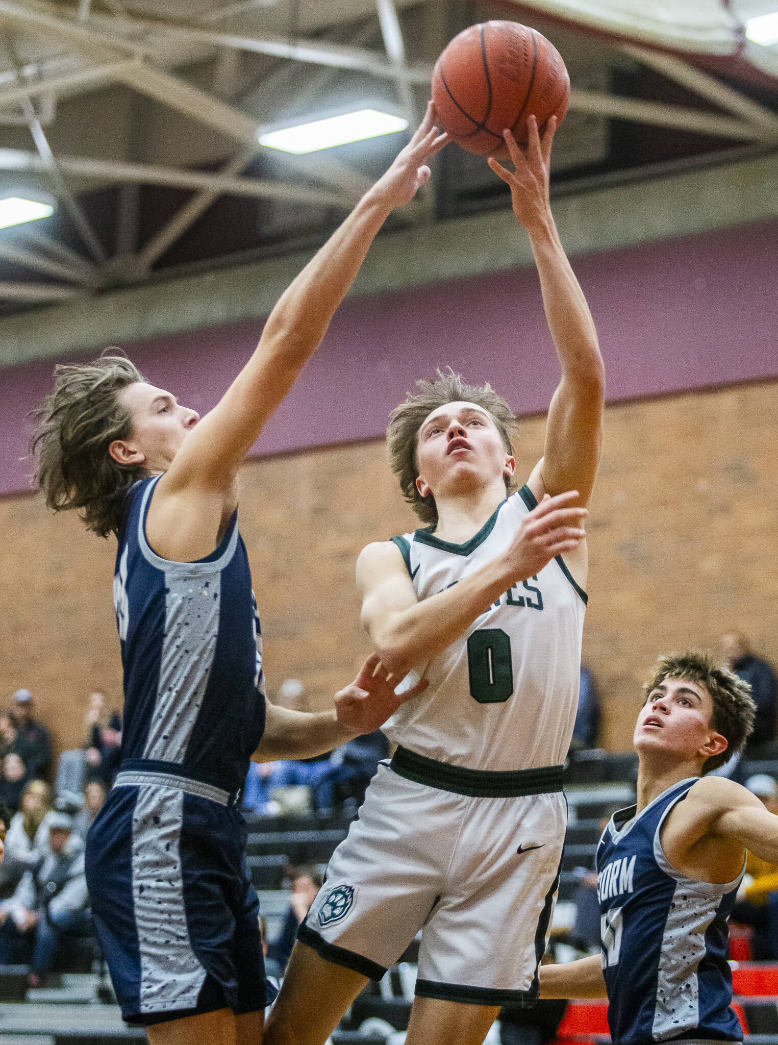 Jackson’s Jackson Rabe gets his layup blocked during the game against Squalicum on Friday, Dec. 27, 2024 in Mountlake Terrace, Washington. (Olivia Vanni / The Herald)