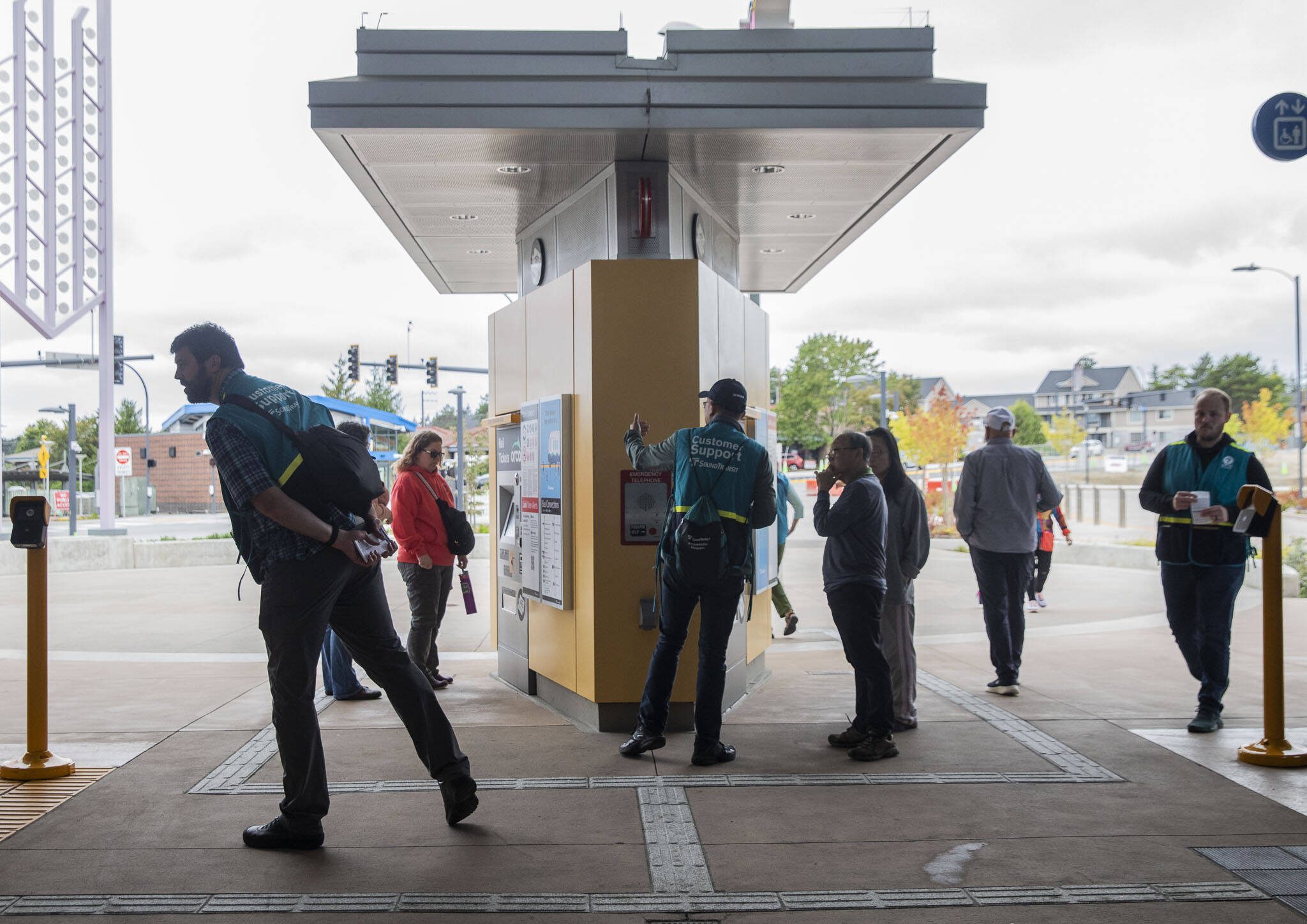 Sound Transit Community Support personnel help riders navigate the new station on Tuesday, Sept. 3, 2024 in Lynnwood, Washington. (Olivia Vanni / The Herald)