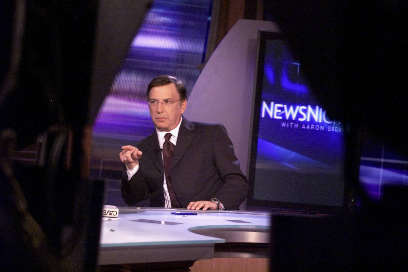 FILE — The CNN anchor Aaron Brown, on set in New York on May 9, 2002. Brown, the longtime television anchor whose coverage during CNN’s live broadcast of the Sept. 11, 2001, terror attacks became one of the most well-known records of the day, died in Washington, D.C. on Dec. 29, 2024. He was 76. (Richard Perry/The New York Times)