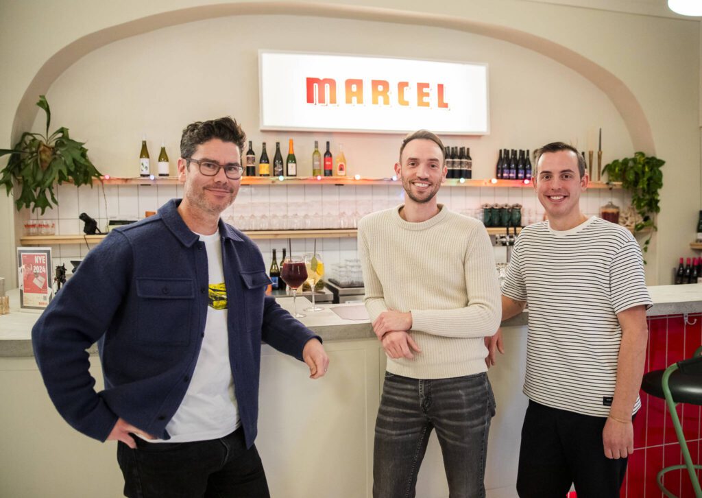 Marcel owners John Baca, Scott Hulme and Aaron Sheckler inside their new beer and wine bar Dec. 19 in Everett. (Olivia Vanni / The Herald)
