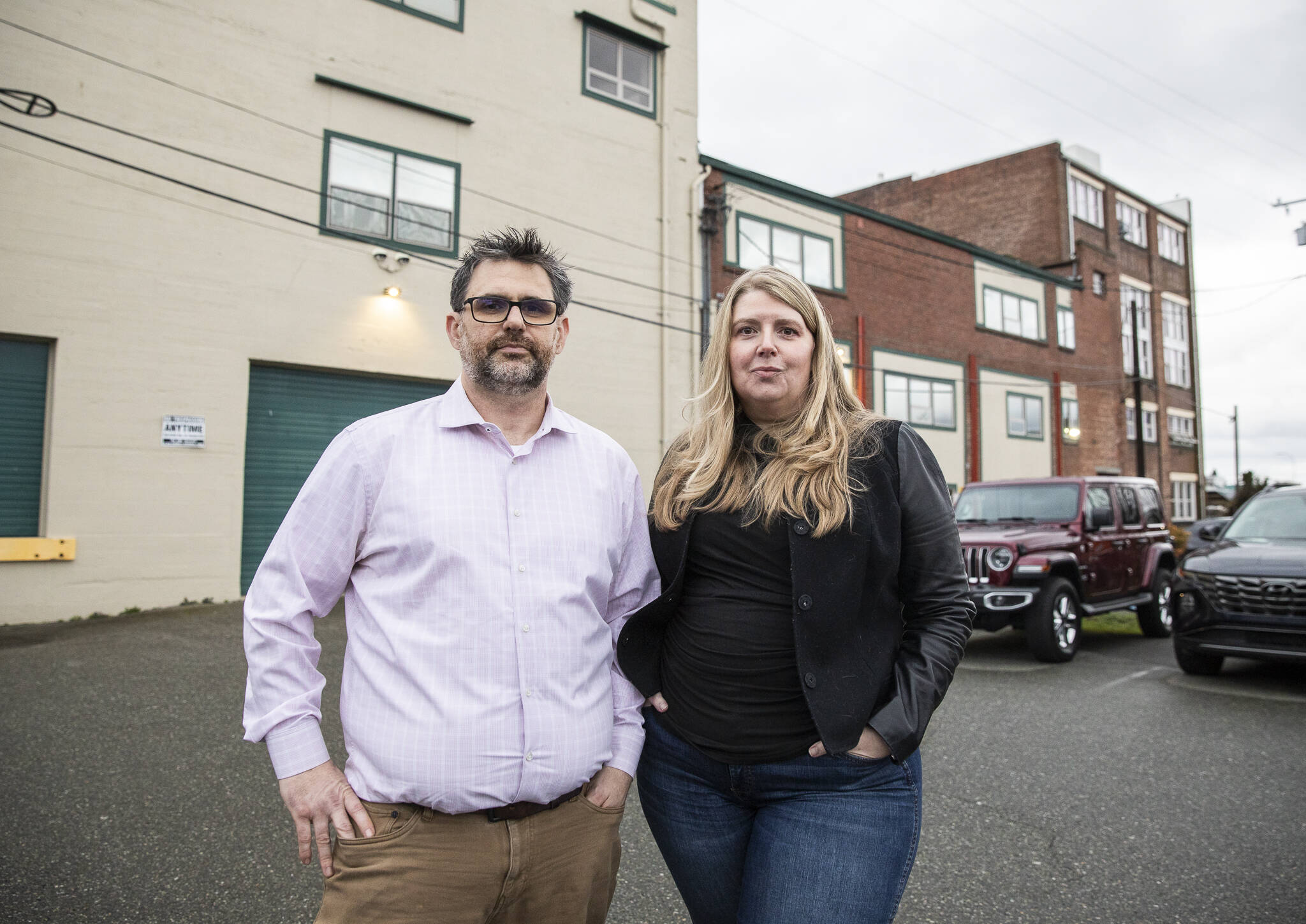Jeremy and Elizabeth Reed, owners of Interface Technologies Northwest, outside of their business on Monday, Dec. 30, 2024 in Everett, Washington. (Olivia Vanni / The Herald)