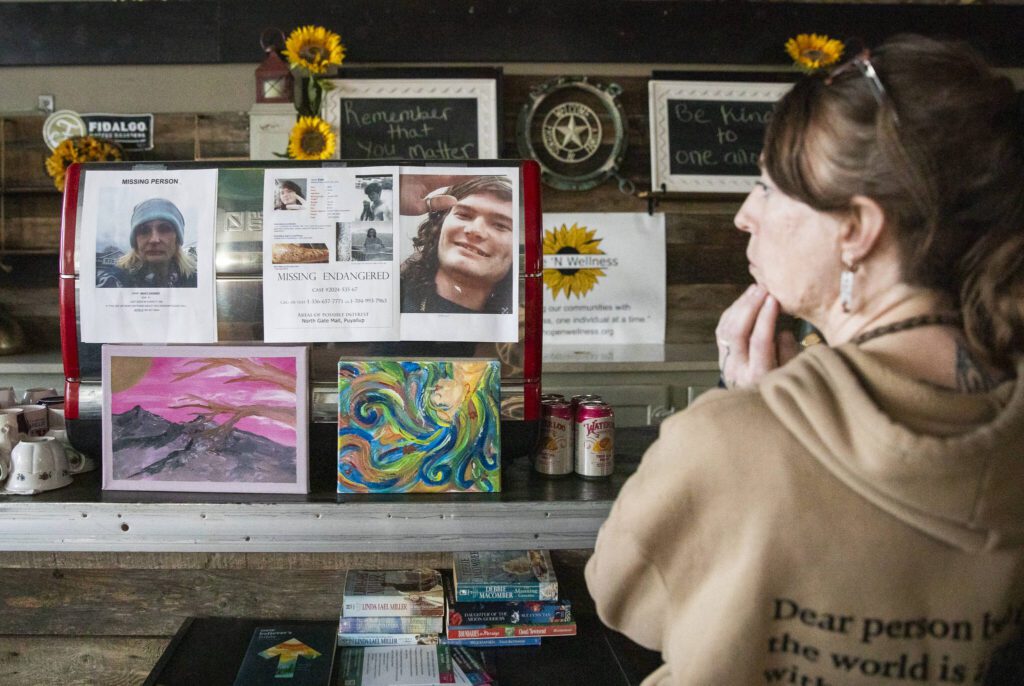Jasmine Donahue talks about being a place for people leave messages when looking for family members, friends or loved ones on the street on Thursday, Jan. 9, 2025 in Everett, Washington. (Olivia Vanni / The Herald)
