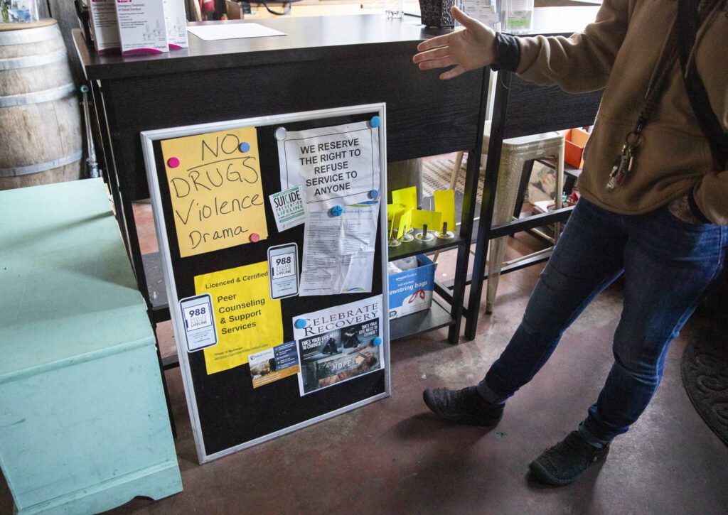 Jasmine Donahue displays her one rule for being in Hope ’N Wellness, “no drugs, violence or drama,” at the entrance on Thursday, Jan. 9, 2025 in Everett, Washington. (Olivia Vanni / The Herald)

