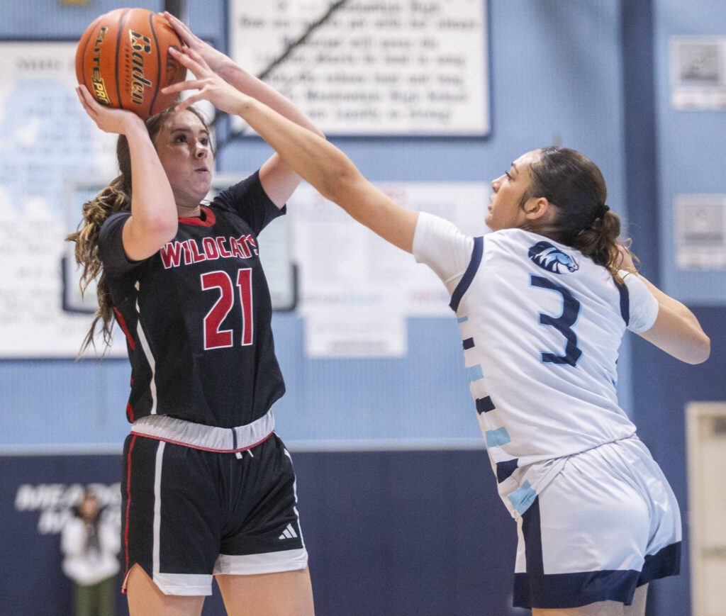 Archbishop Murphy’s Ava Marr tries to get a shot off while being guarded by Meadowdale’s Kaiya Dotter during the game on Friday, Jan. 3, 2025 in Lynnwood, Washington. (Olivia Vanni / The Herald)
