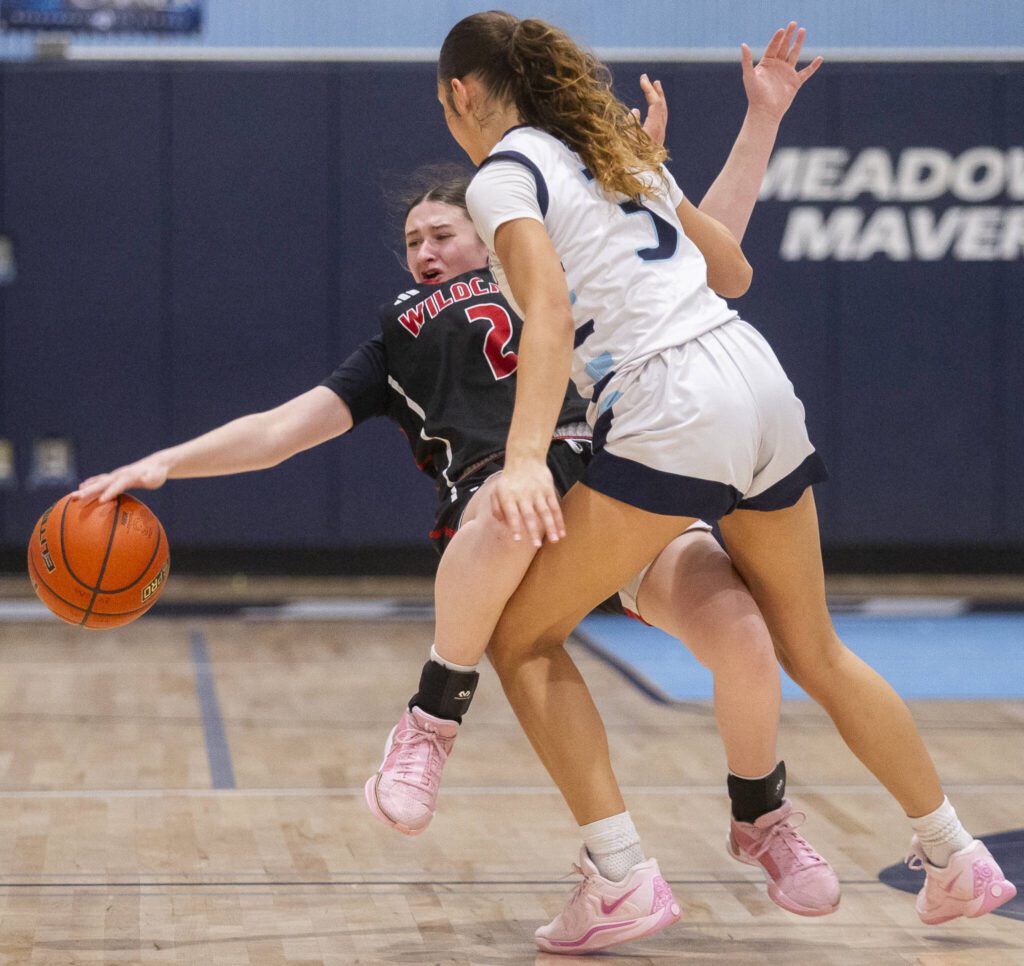 Archbishop Murphy’s Brooke Blachly is knocked over and fouled by Meadowdale’s Kaiya Dotter during the game on Friday, Jan. 3, 2025 in Lynnwood, Washington. (Olivia Vanni / The Herald)
