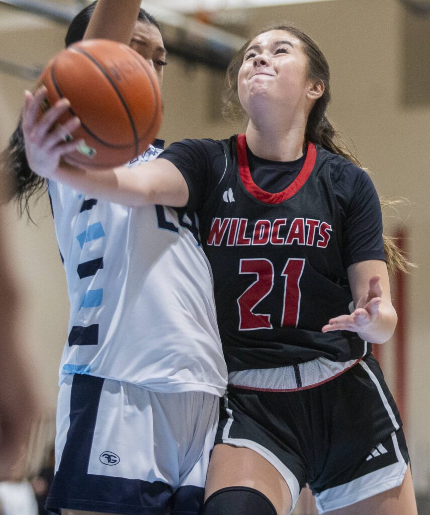 Archbishop Murphy’s Ava Marr tries to makes a layup while being guarded during the game against Meadowdale on Friday, Jan. 3, 2025 in Lynnwood, Washington. (Olivia Vanni / The Herald)
