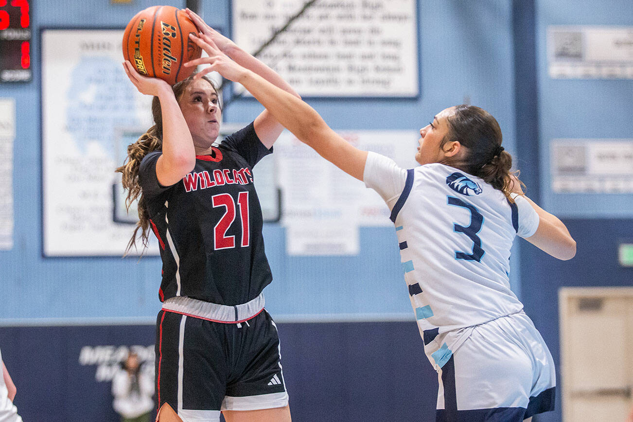Archbishop Murphy’s Ava Marr tries to get a shot off while being guarded by Meadowdale’s Kaiya Dotter during the game on Friday, Jan. 3, 2025 in Lynnwood, Washington. (Olivia Vanni / The Herald)