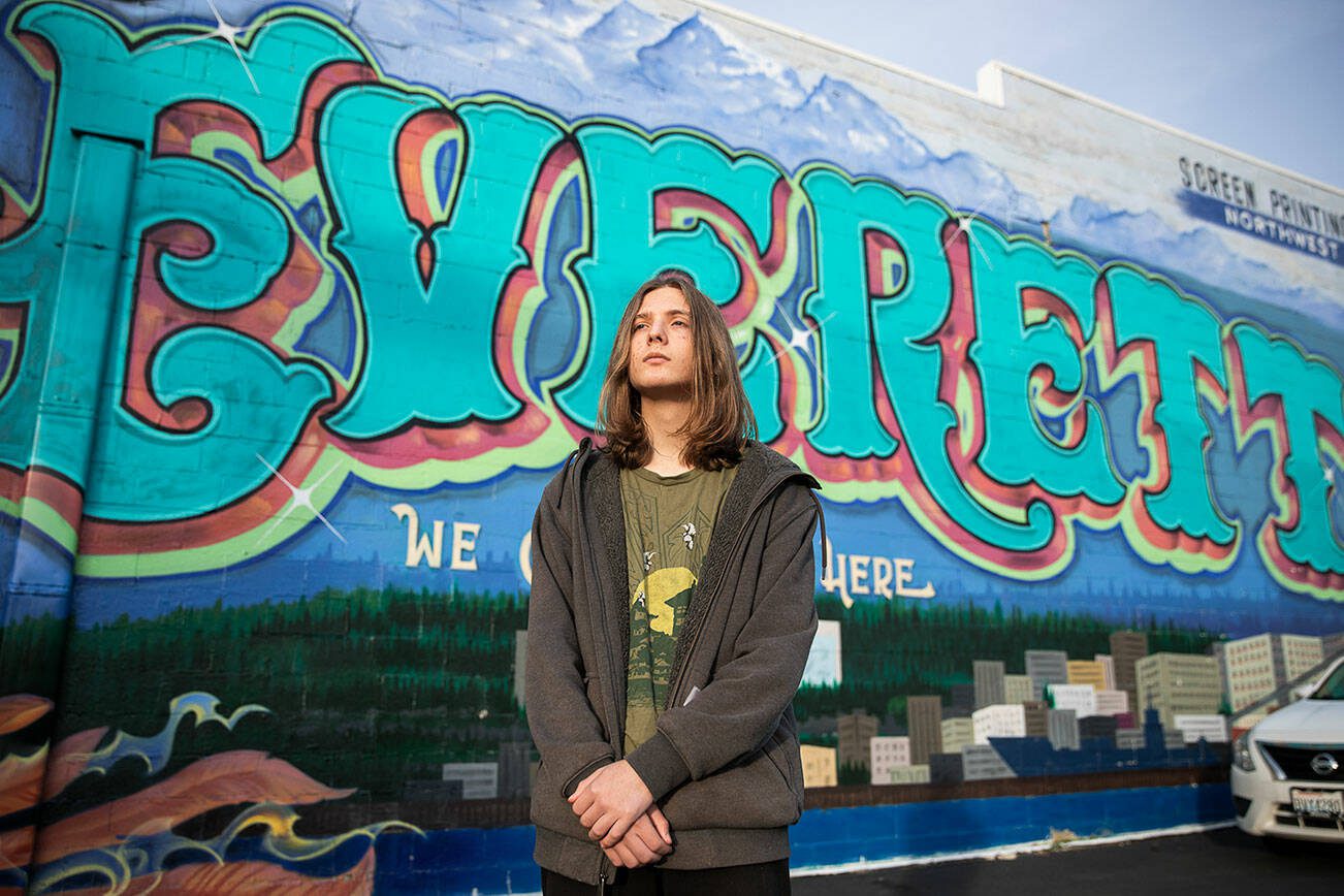Everett P. Fog, 15, in front of an Everett mural along Colby Avenue on Wednesday, Jan. 22, 2025 in Everett, Washington. (Olivia Vanni / The Herald)