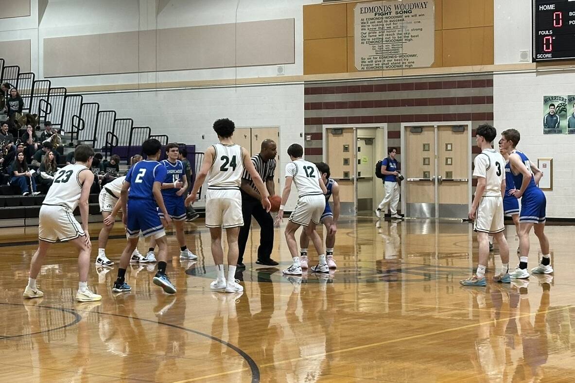 Edmonds-Woodway and Shorewood boys basketball prepare for tip-off during a league game on Jan. 14, 2025 at Edmonds-Woodway High School. (Qasim Ali / The Herald)
